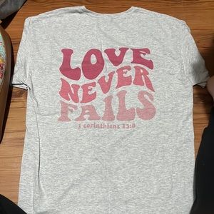 Love never fails sublimation tee. Clear front. Print on back.